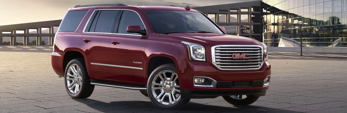 2020 GMC Yukon parked with a bridge in the background