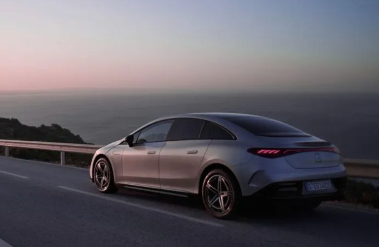 rear and side view of a Mercedes-Benz on the road