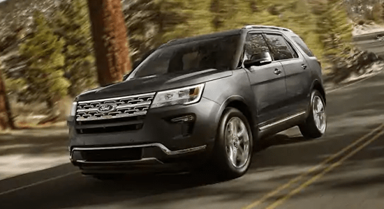 2019 Ford Explorer Limited driving on forested road