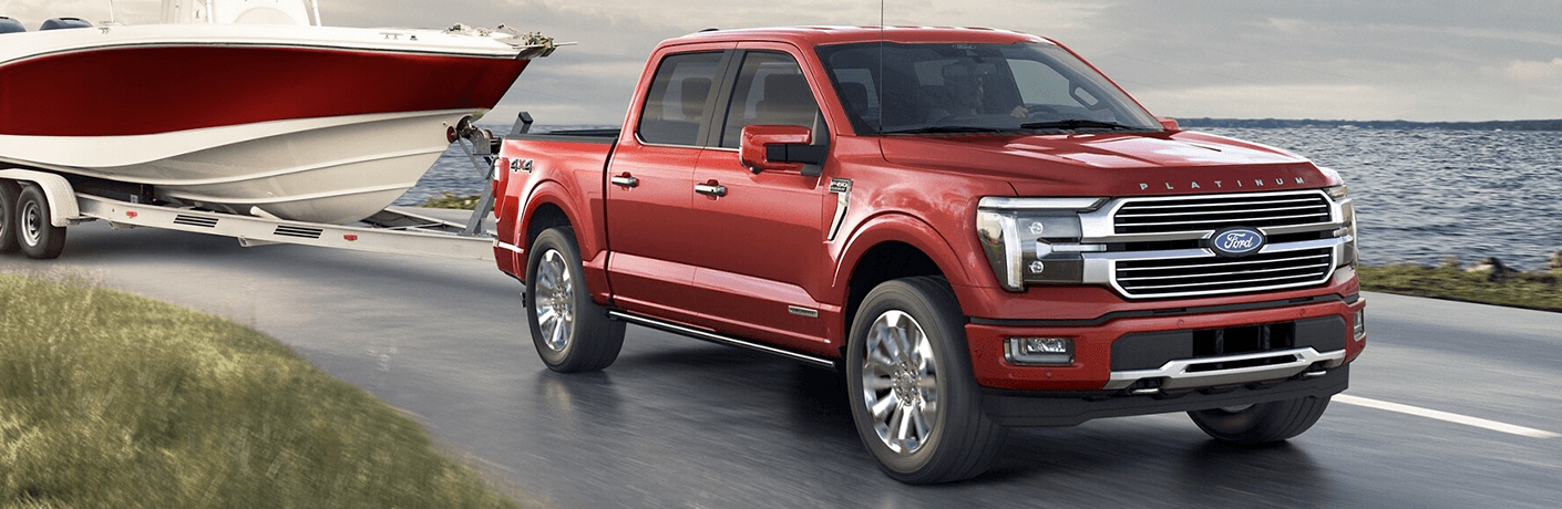 2024 Ford F-150 towing a boat by water