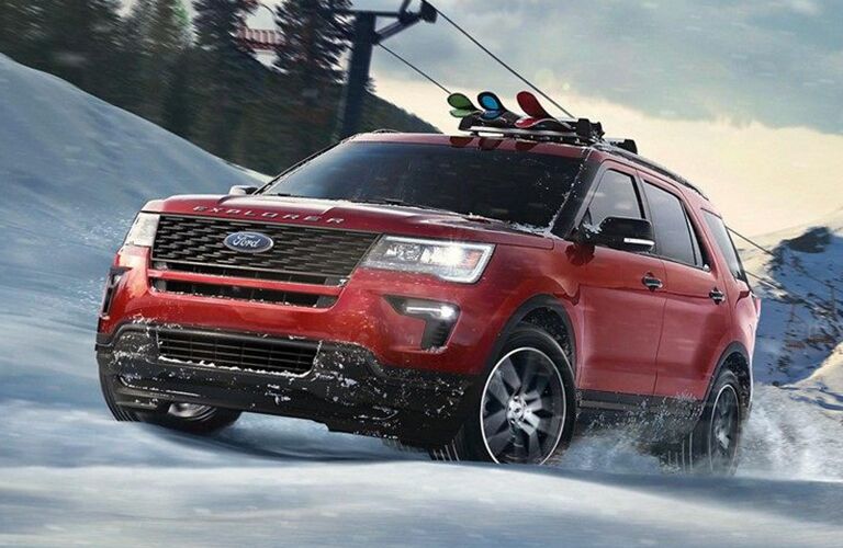 Red 2019 Ford Explorer Driving in Snow