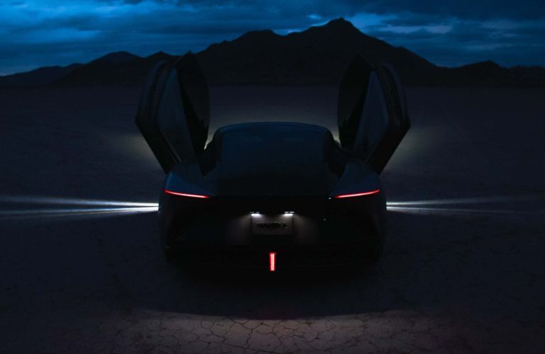 2027 Karma Kaveya rear view at night with open doors