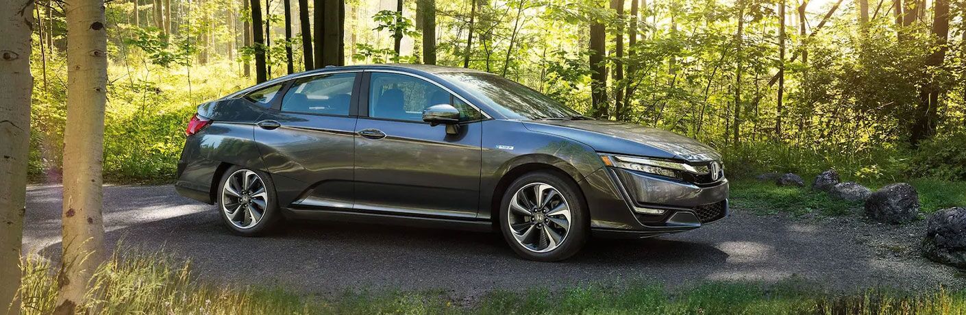 2021 Honda Clarity side view in the woods