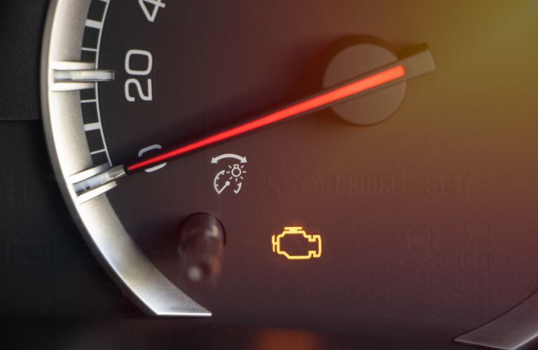 a warning light glowing in a vehicle dahboard