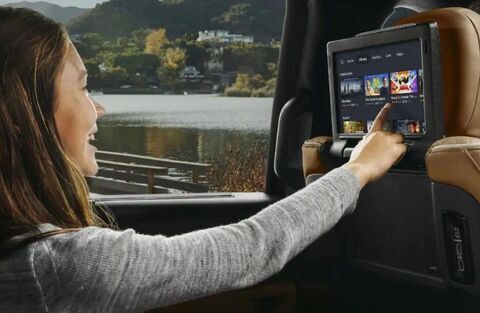 Kid using the rear entertainment screen in the 2023 Chrysler Pacifica Hybrid