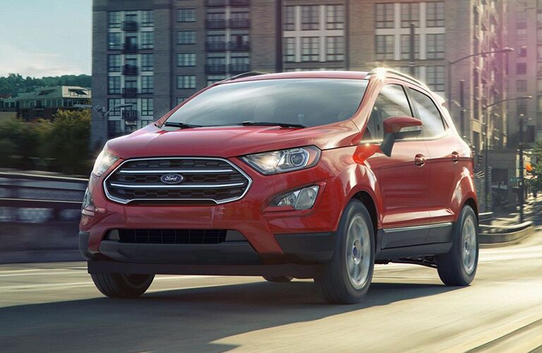 Front view of red 2019 Ford EcoSport driving on city street