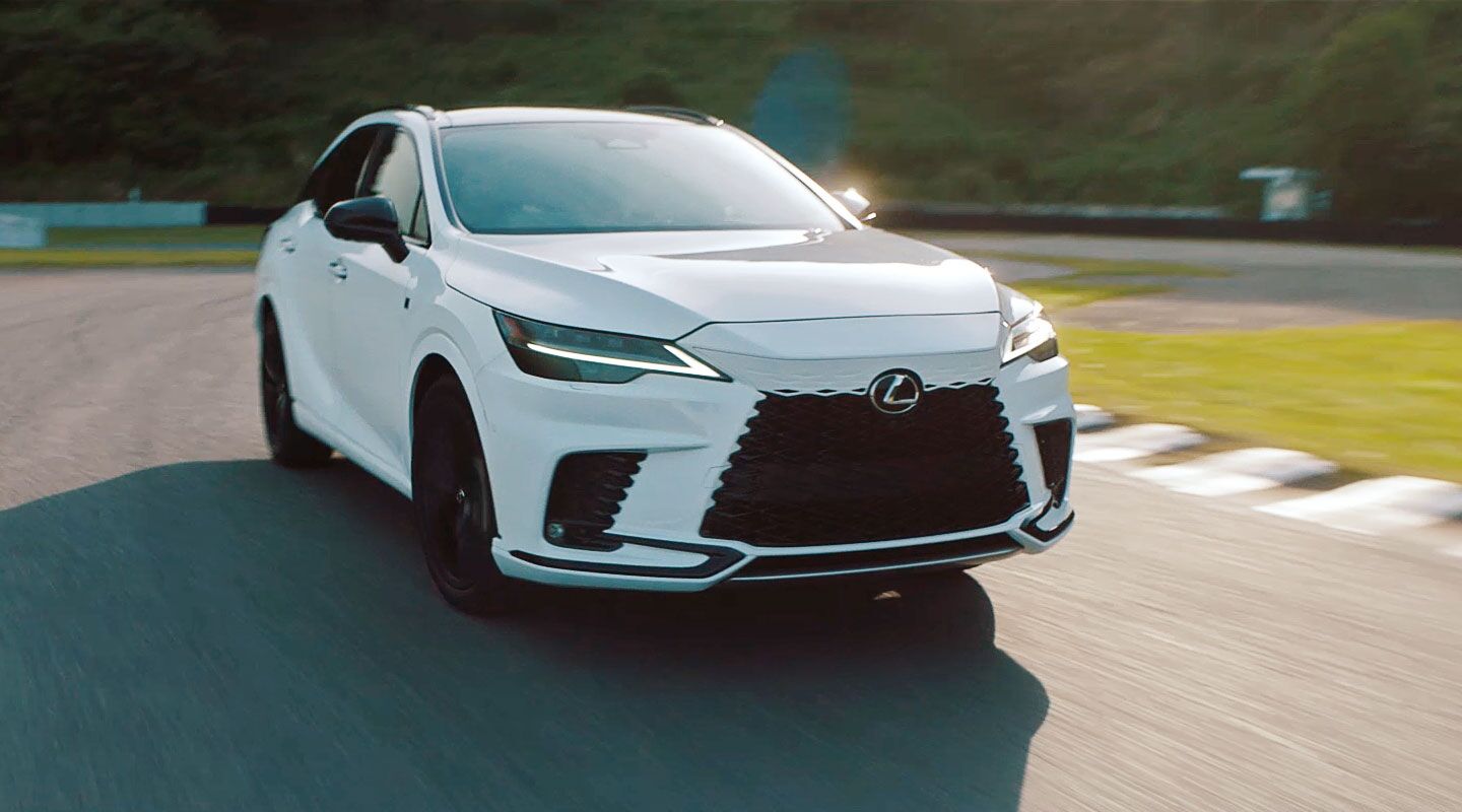 Man Standing next to 2023 Lexus RX