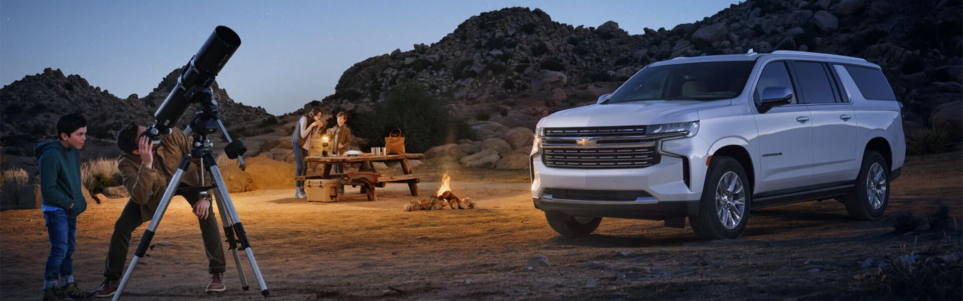 Chevrolet Suburban parked by a fire