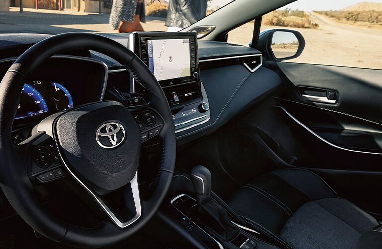 Steering wheel, gauges, and touchscreen in 2021 Toyota Corolla Hatchback