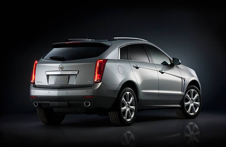 Rear/side view of a 2016 Cadillac SRX on a black background