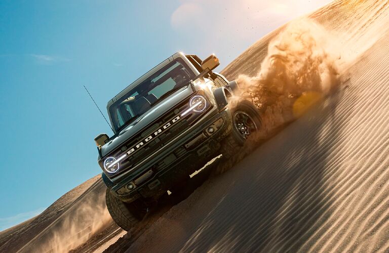 2021 Ford Bronco WildTrak driving in sand