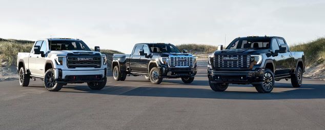 2025 GMC Sierra HD Trucks on a Road