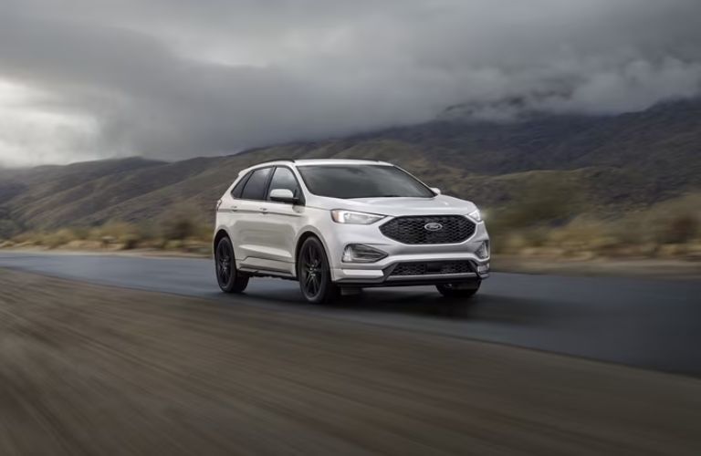 2024 Ford Edge White driving on the road