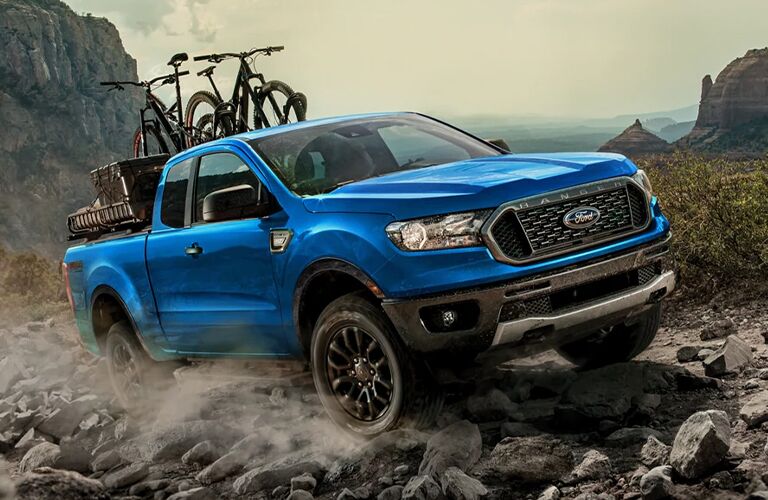 One blue color 2022 Ford Ranger with bikes at the back