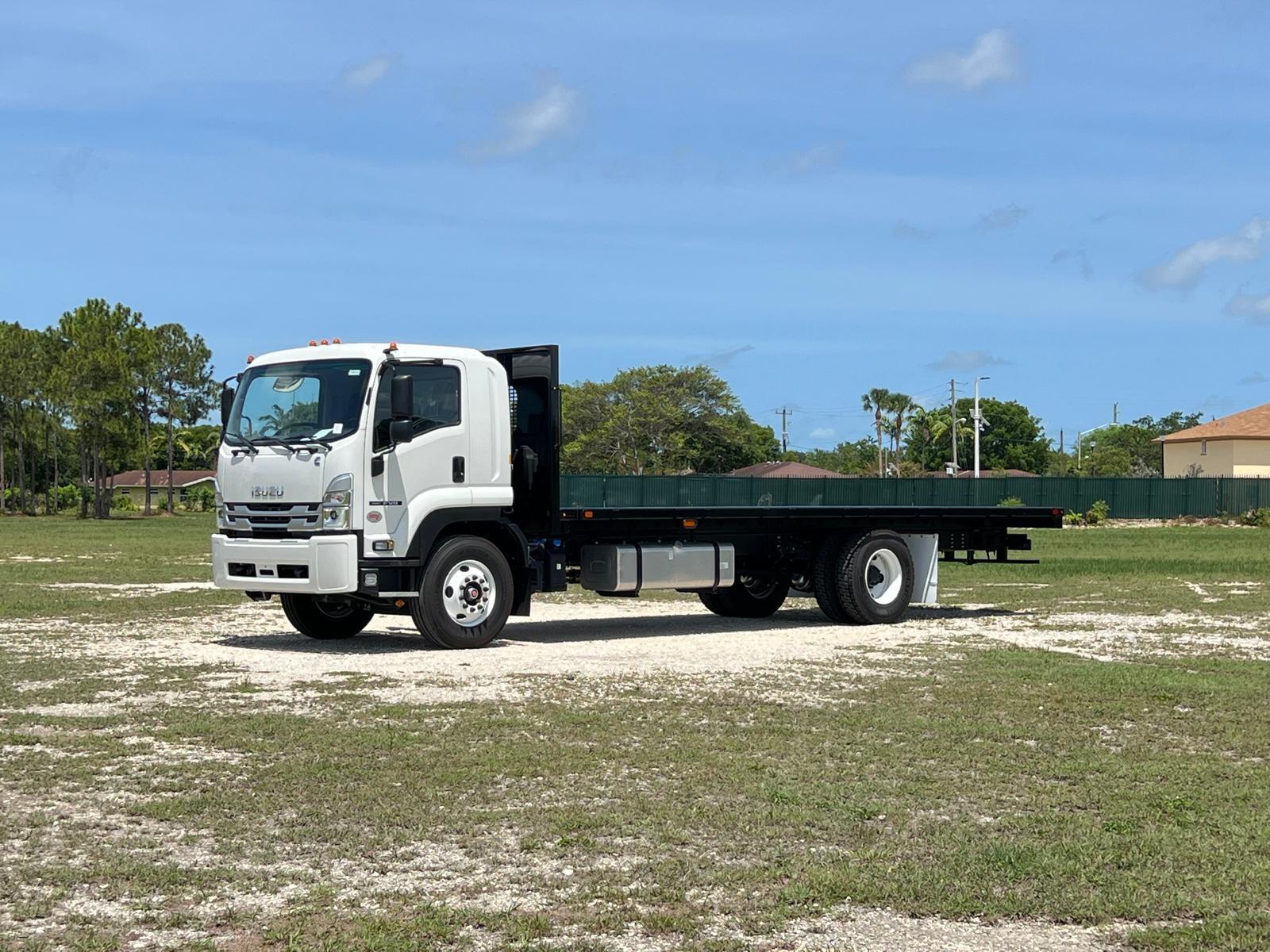 A side exterior view of a flatbed truck