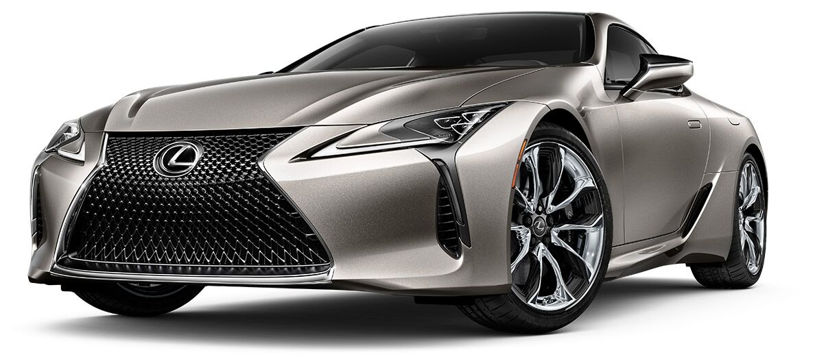Exterior of the Lexus LC Hybrid shown in Atomic Silver on a coastal highway  background.