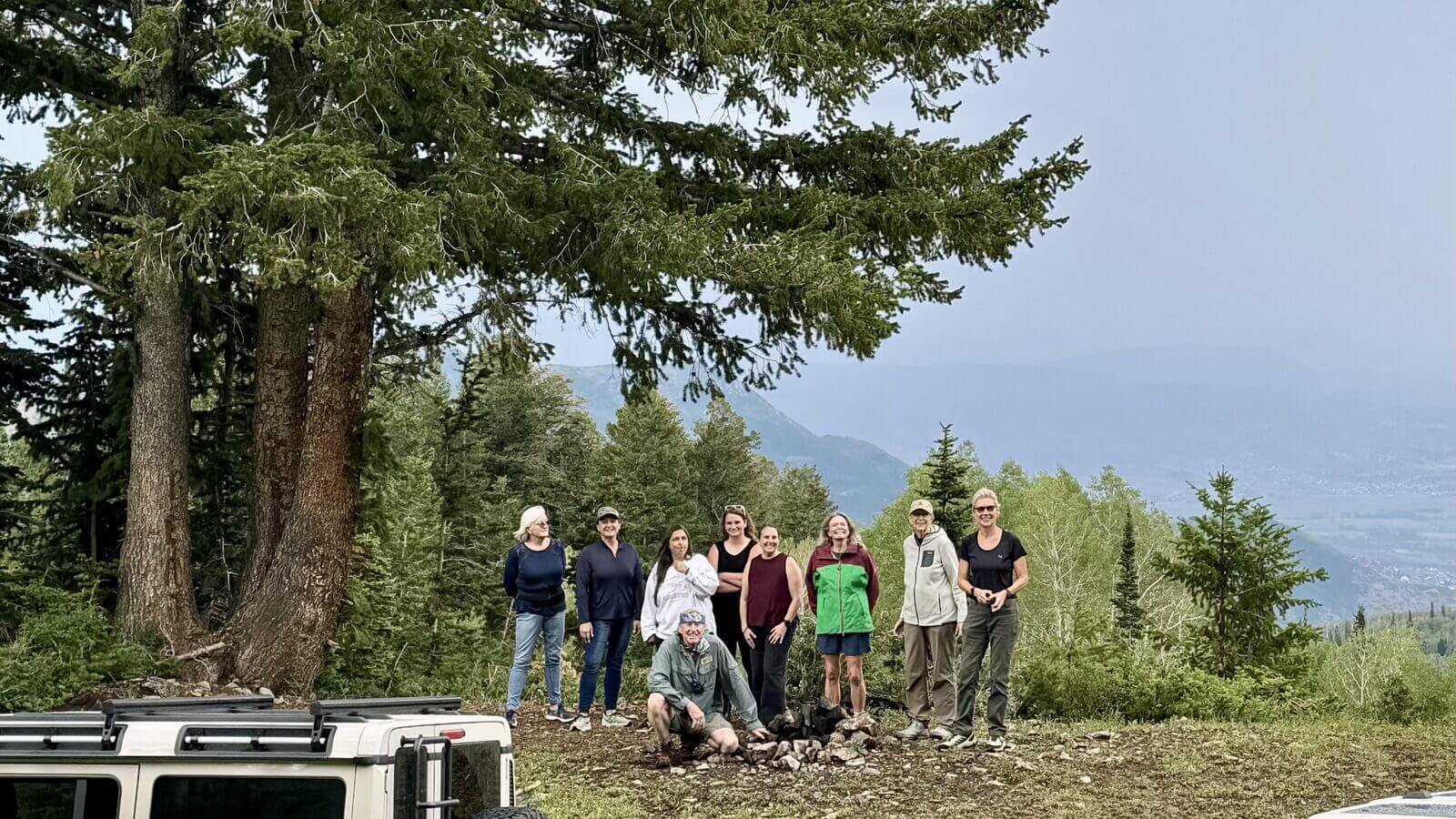 Group of women participants on an alpine ridge with Grenadiers during the Unlocking the Beast women's off-road masterclass in Utah