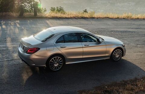 2023 Mercedes-Benz C-Class Hybrid Gray driving on the road