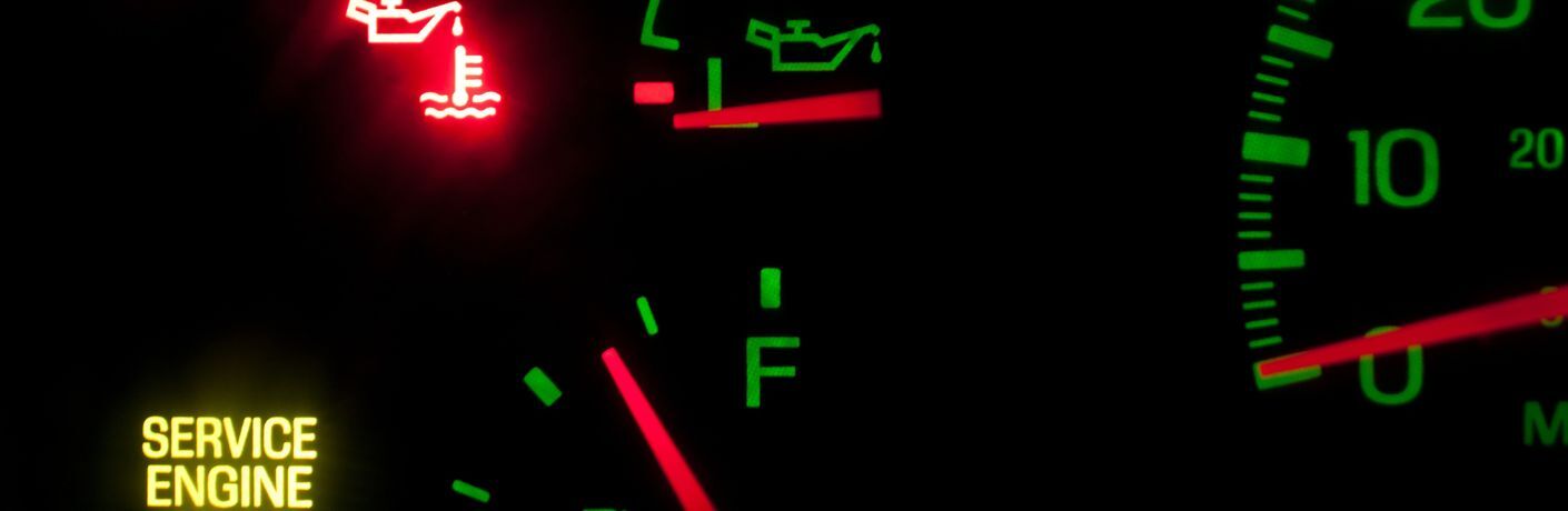 close up image of dashboard warning lights