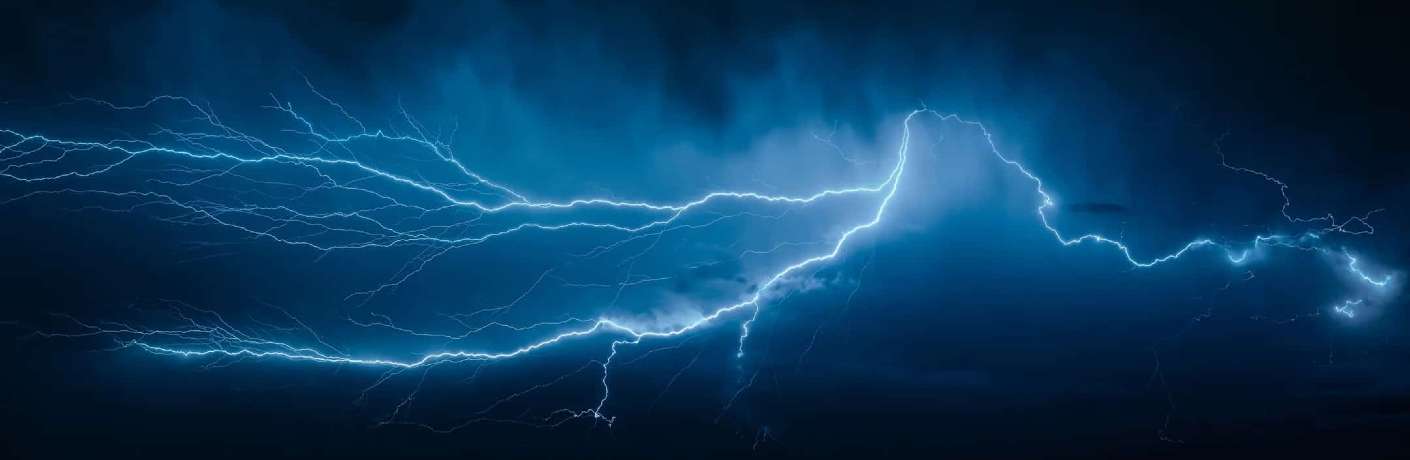 Lightning streaks across the sky at night