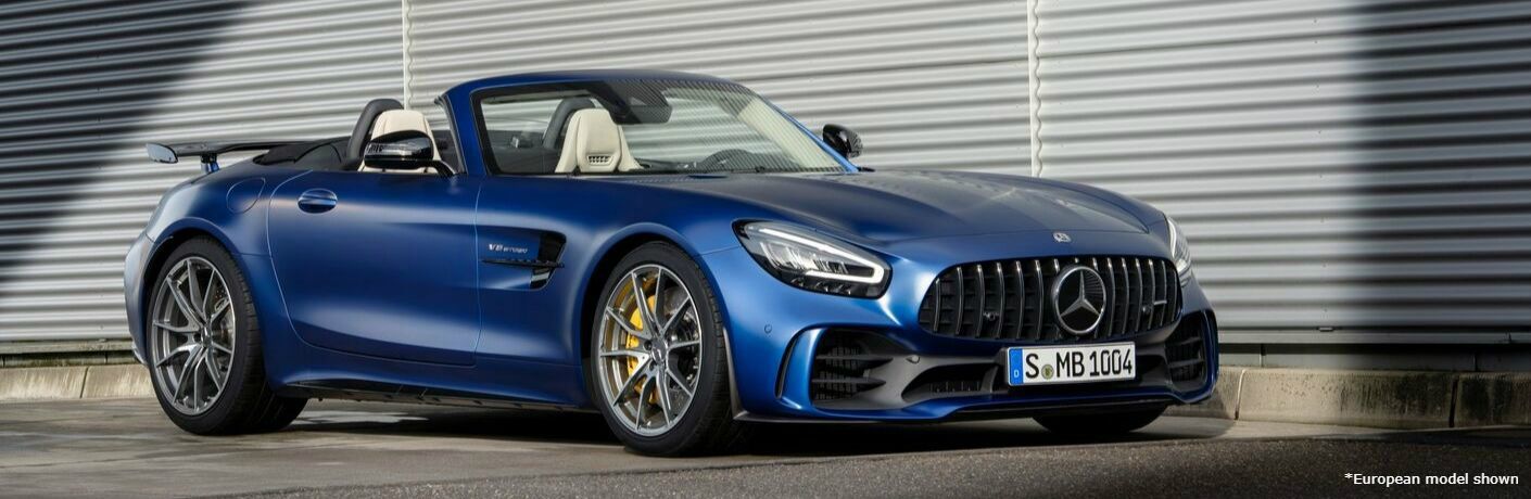 2020 MB GT Coupe exterior front fascia passenger side in front of large garage door