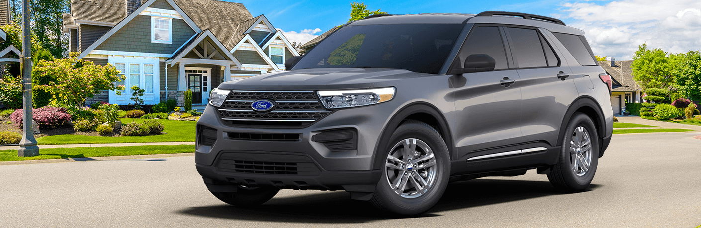 2023 Ford Explorer XLT parked in the road in front of a house