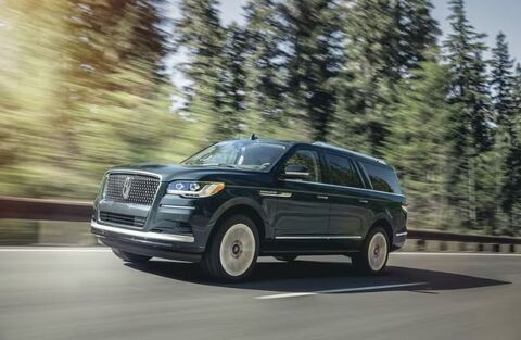 2023 Lincoln Navigator Blue driving on the road