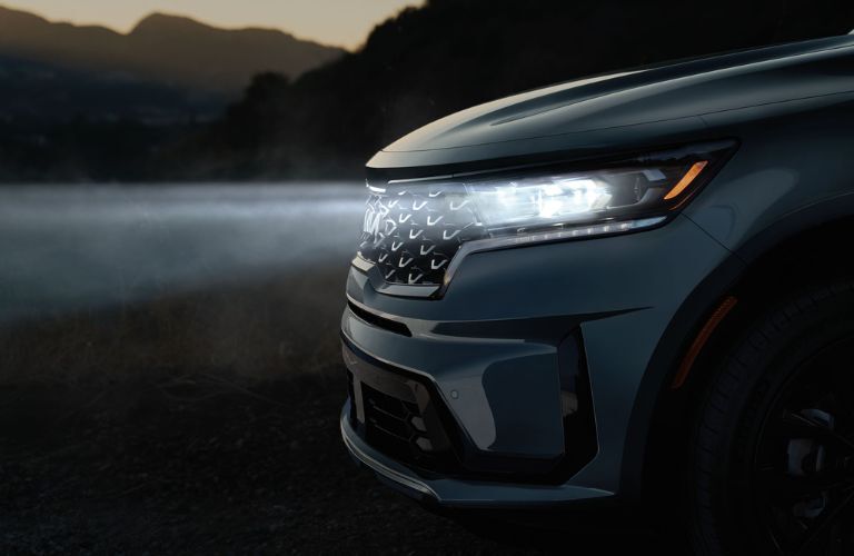 The 2023 Kia Sorento with headlights on
