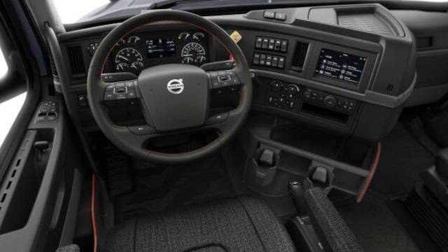 An interior cab view of a Volvo bigrig commercial truck