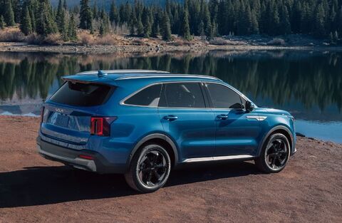 2025 Kia Sorento Hybrid Blue near lake