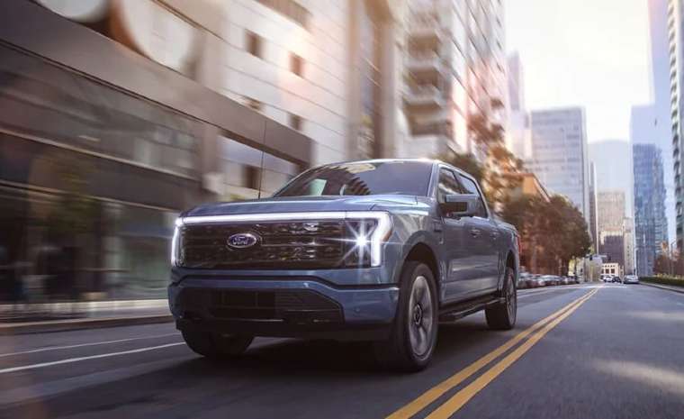 2022 Ford F-150 Lightning travelling on urban city roadway