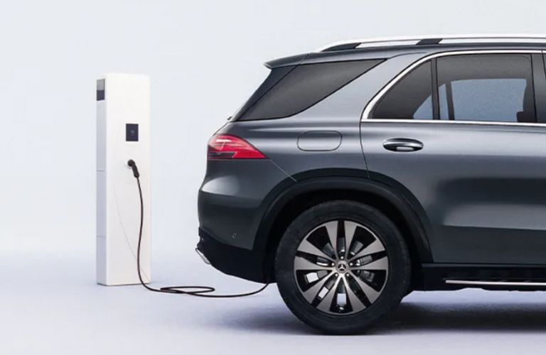 side view of the 2025 Mercedes-Benz GLE SUV getting charged