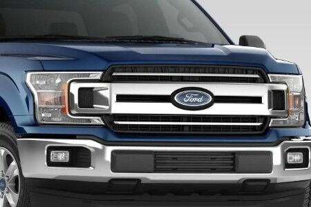Front grille and headlights of blue 2019 Ford F-150 XLT