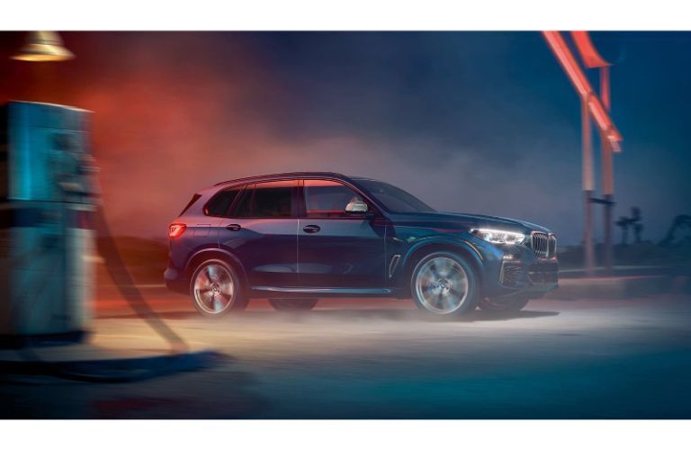 2020 BMW X5 at a dusty gas station