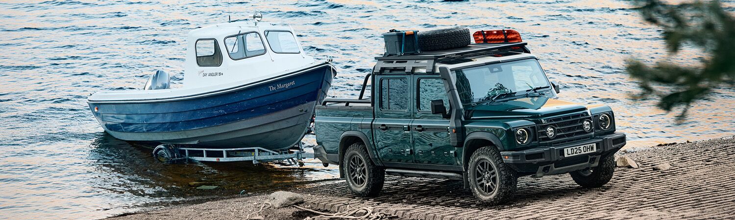 Side shot of INEOS towing boat out of water