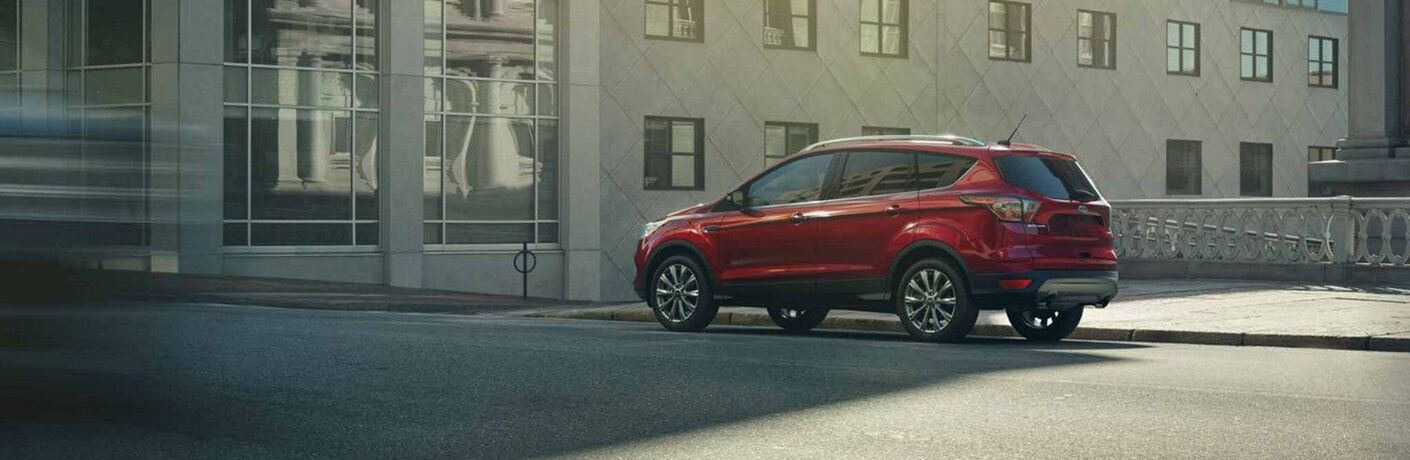 Red 2019 Ford Escape parked on city street