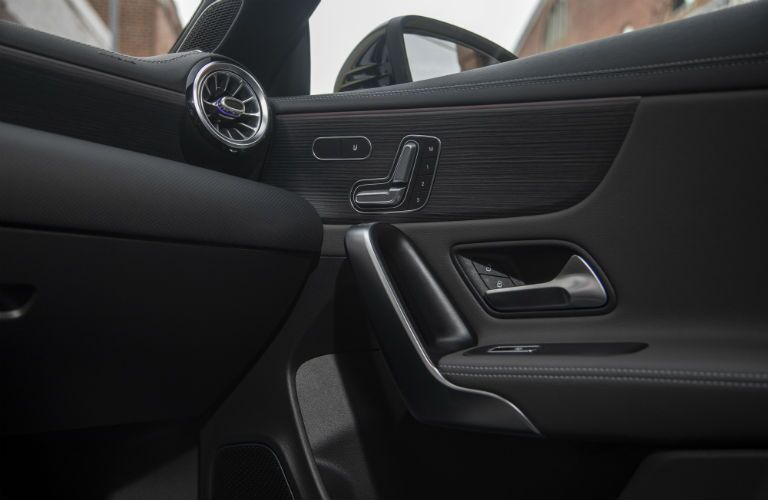 2020 MB CLA interior front cabin low view of passenger side door controls and partial dashboard
