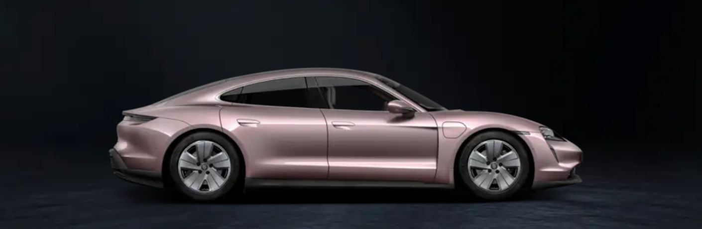One brown color 2024 Porsche Taycan is shown in black background.
