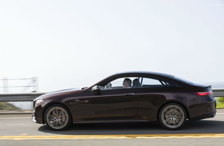 2019 MB E-Class Coupe exterior driver side profile going fast on blurred highway