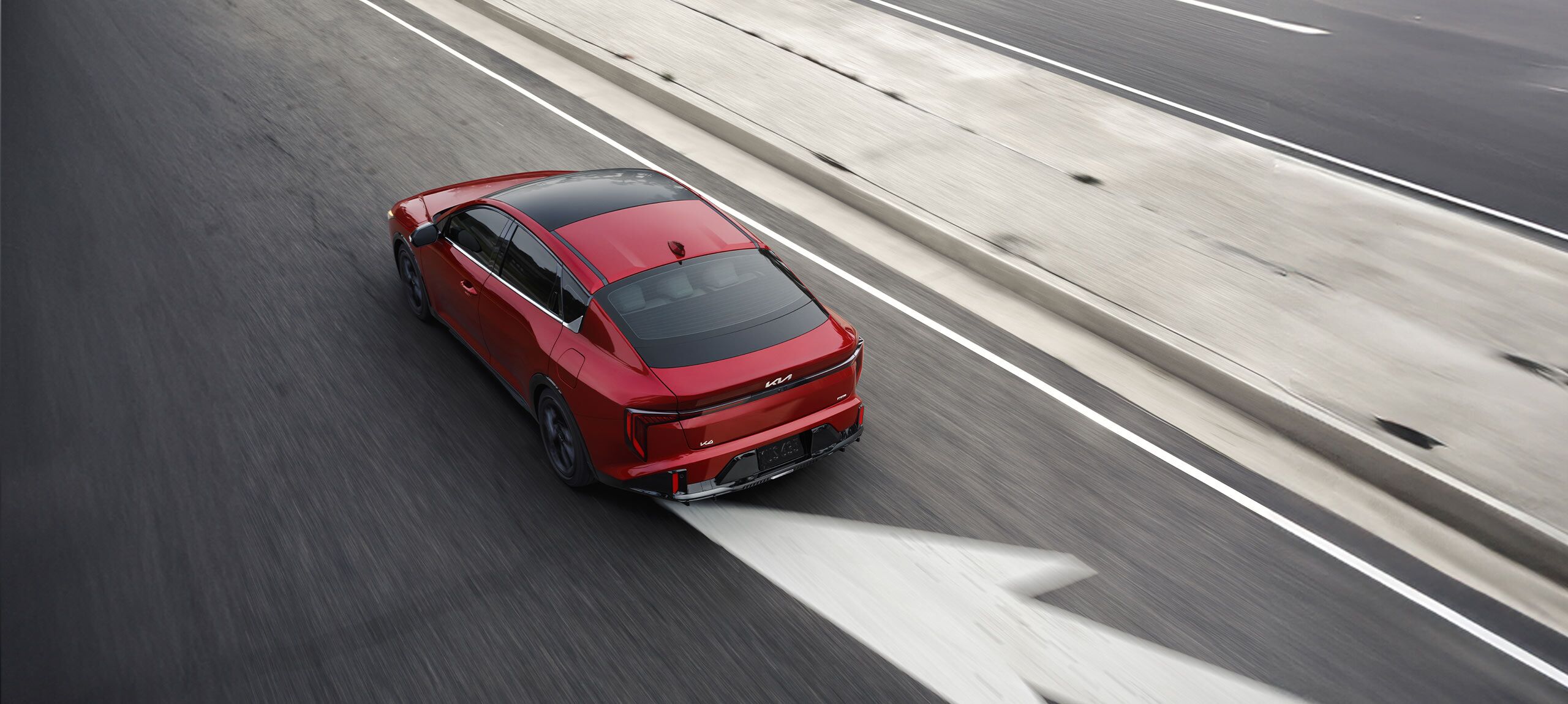 2026 Kia K4 driving down the road
