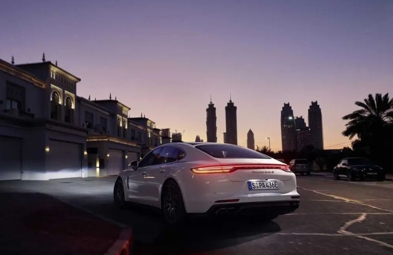 2022 Porsche Panamera exterior rear view with tail lights on