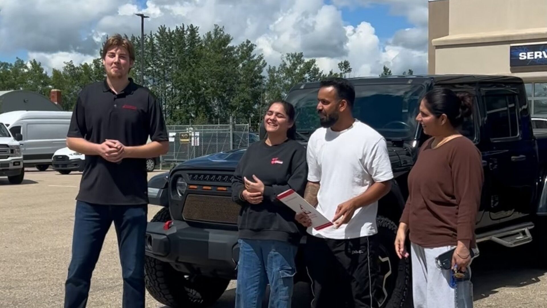Jeremy, Basant and Family at Redwater Dodge