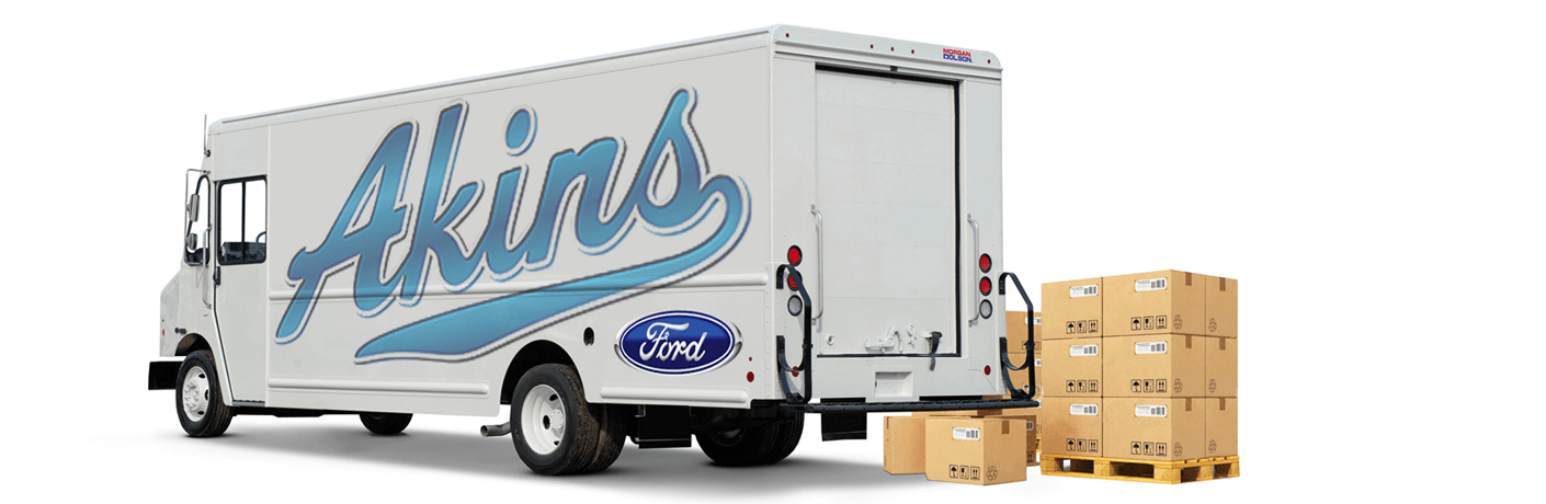 Akins Ford Step Van with Akins Ford logo on the side panel and boxes on a pallet next to it.