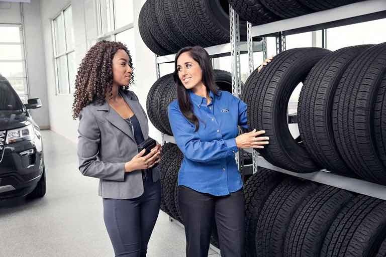 Tire Consultant helping customer choose the right tires
