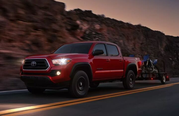 2023 Toyota Tacoma Red towing bikes