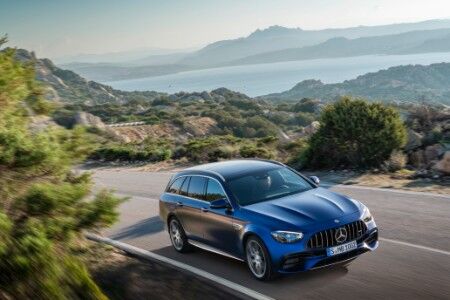 2021 MB E-Class Wagon exterior front fascia passenger side top view on highway next to lake_o