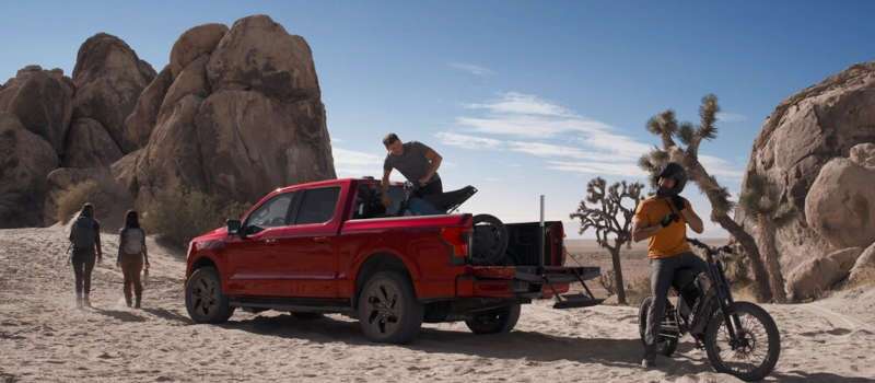 A rear 3/4 view of the Ford F-150 Lightning out in the desert