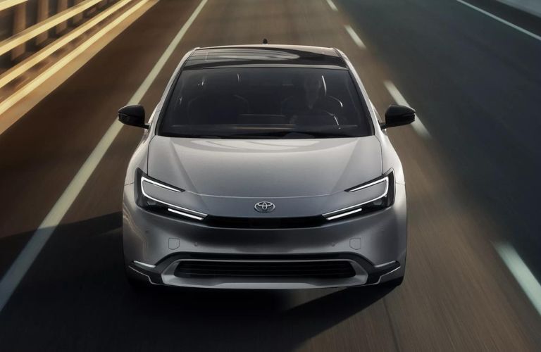 One grey color 2023 Toyota Prius is running on the road.