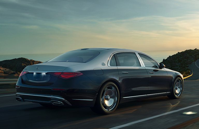 Rear view of the 2022 Mercedes-Maybach S 580 driving on road