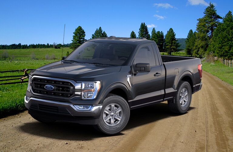 2021 Ford F-150 XLT front view on a dirt road